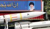 An Iranian military truck carries parts of a Sayad 4-B missile past a portrait of supreme leader Ayatollah Ali Khamenei.
