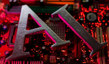 AI (Artificial Intelligence) letters and robot hand are placed on computer motherboard in this illustration taken. (REUTERS)