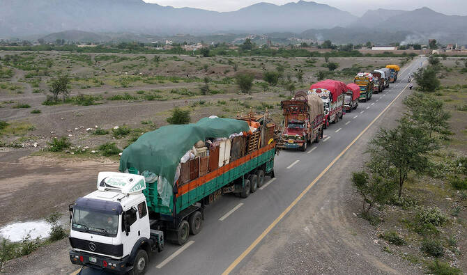 Trucks build up at border as Afghans pushed out of Pakistan wait to cross