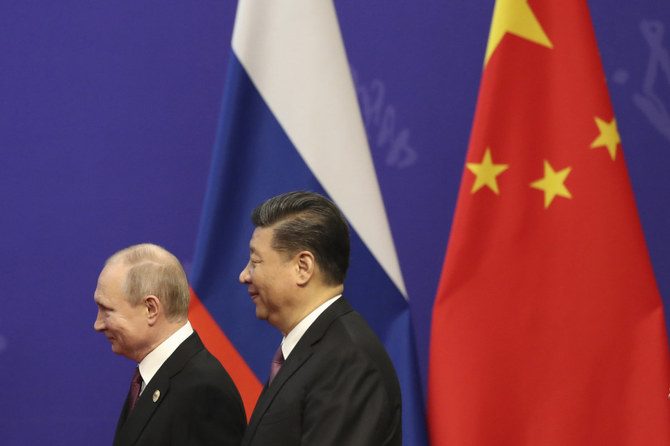 Presidents for life Vladimir Putin of Russia, right, and i Jinping of China.  (Kenzaburo Fukuhara/Pool Photo via AP, File) 