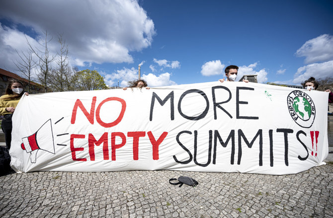 Activists from the environmental group Fridays for Future demonstrate at Berlin's Invalidenpark on April 23, 2021, demanding immediate action against climate change. (Fabian Sommer/dpa via AP)