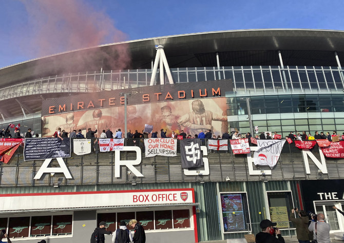 In this April 23, 2021 photo, fans protest against Arsenal owner Stan Kroenke before their English Premier League soccer match against Everton, outside the Emirates Stadium in London.(AP File Photo)