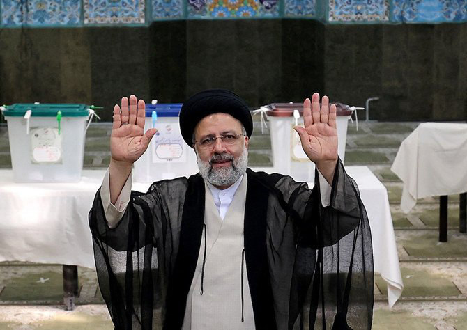 In this file photo taken on June 18, 2021 Iran's President Ebrahim Raisi waves after casting his ballot for presidential election in Tehran. (AFP)