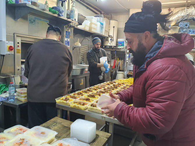 Hiba Express staff prepare food for workers of the UK’s National Health Service as the whole world came under pandemic lockdown in April last year. (Supplied)