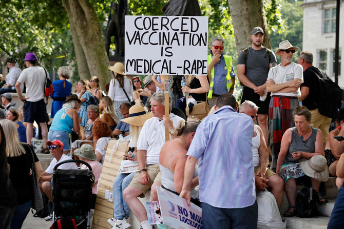 Anti-vaccination protesters gather outside the Houses of Parliament in London on July 19, 2021, as coronavirus restrictions are lifted in England. (AFP / Tolga Akmen)