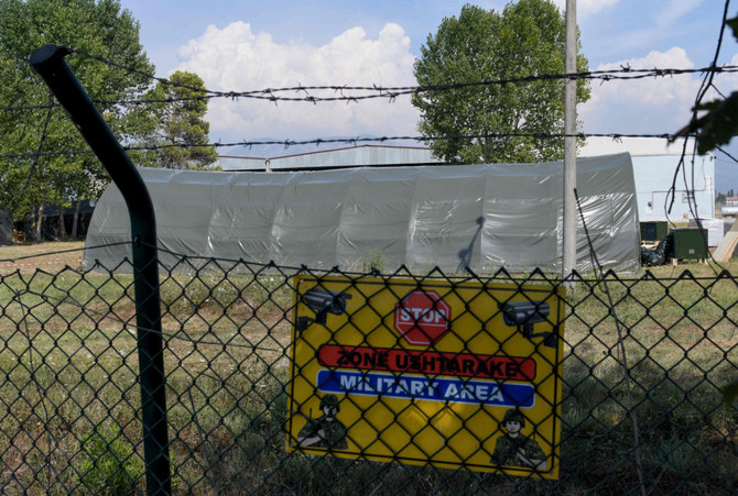 A picture taken on August 18, 2021 shows tents raised for the arrival of Afghan refugees, inside of the military part of the Rinas Airport, in Tirana, Albania. (Photo by Gent Shkullaku / AFP)