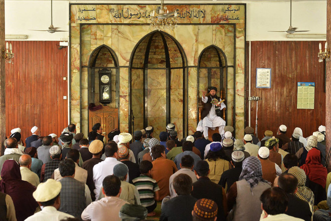 A Taliban official addresses a gathering before Friday prayers at the Wazir Akbar Khan mosque in Kabul on September 17, 2021. (Photo by Hoshang Hashimi / AFP)