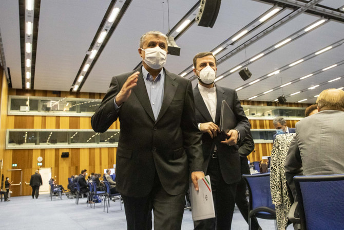 Mohammad Eslami, new head of Iran's nuclear agency, left, and Iran's representative to the IAEA, Kazem Gharib Abadi, leave after attending the IAEA conference in Vienna on Sept. 20, 2021. (AP) 