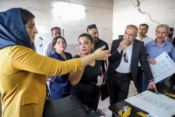 Officials of Iraq's electoral commission undergo a polling day simulation in Sulaymaniyah to test run its systems ahead of the upcoming parliamentary elections. (Photo by Shwan Mohammed / AFP)