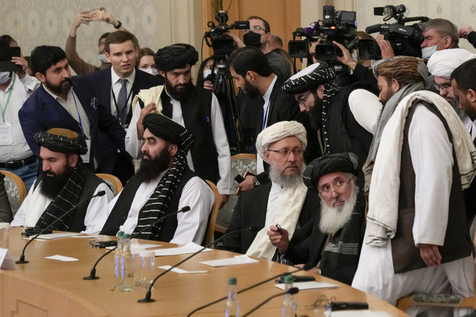 Taliban official Abdul Salam Hanafi, center, and his delegation arrive to attend the talks in Moscow, Russia, on Oct. 20, 2021. (AP Photo/Alexander Zemlianichenko, Pool) 