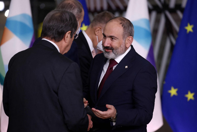 Armenia's Prime Minister Nikol Pashinyan (R) speaks with Cyprus' President Nicos Anastasiades (L) during the Eastern Partnership summit in Brussels on Dec. 15, 2021. (AFP) 
