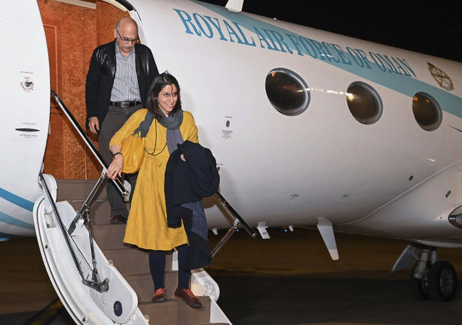 Nazanin Zaghari-Ratcliffe, front, and Anoosheh Ashoori, who were freed from Iran, arrive in Muscat, Oman, on March 16, 2022. (Oman News Agency via AP)