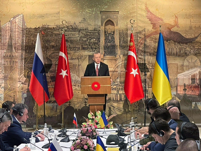 Turkish President Recep Tayyip Erdogan, center, gives a speech to welcome the Russian, left, and Ukrainian delegations ahead of their talks in Istanbul on March 29, 2022. (Ukrainian Foreign Ministry Press Service via AP)