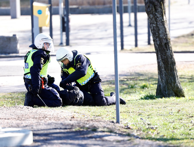 Police detain a person during a riot in Norrkoping, Sweden, on April 17, 2022, ahead of a planned anti-Muslim demonstration. (Stefan Jerrevang/TT News Agency/via REUTERS)