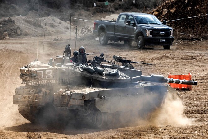 An Israeli army main battle tank moves at a position along the border with Lebanon in northern Israel on October 1, 2024. (AFP)