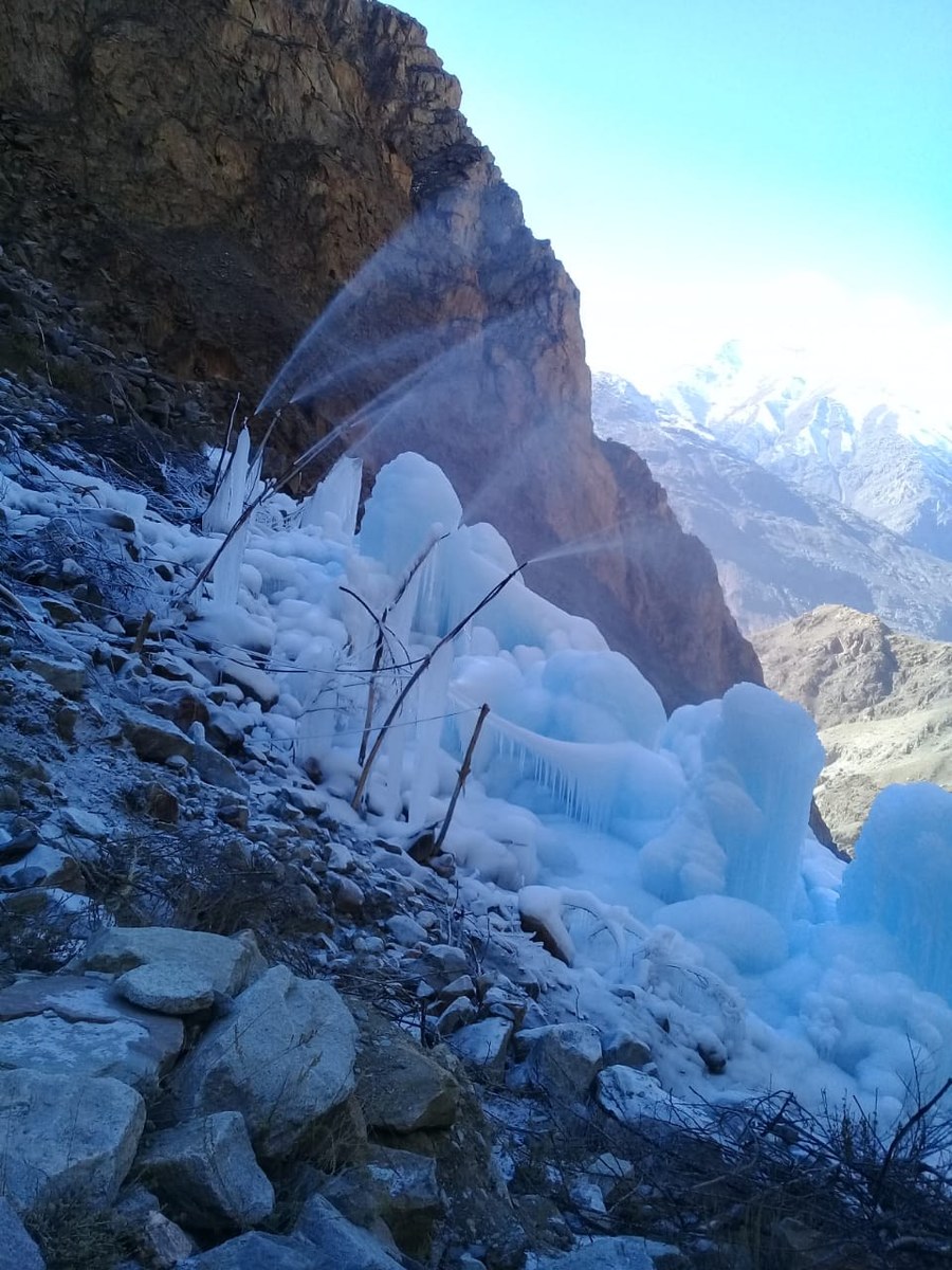 A view of an ice stupa site located in Pari Village of Kharmang district in Gilgit-Baltistan, Pakistan, on March 5, 2021. (Photo Courtesy: Rashid-ud-Din). [Water being sprayed into the air through pipes] 
